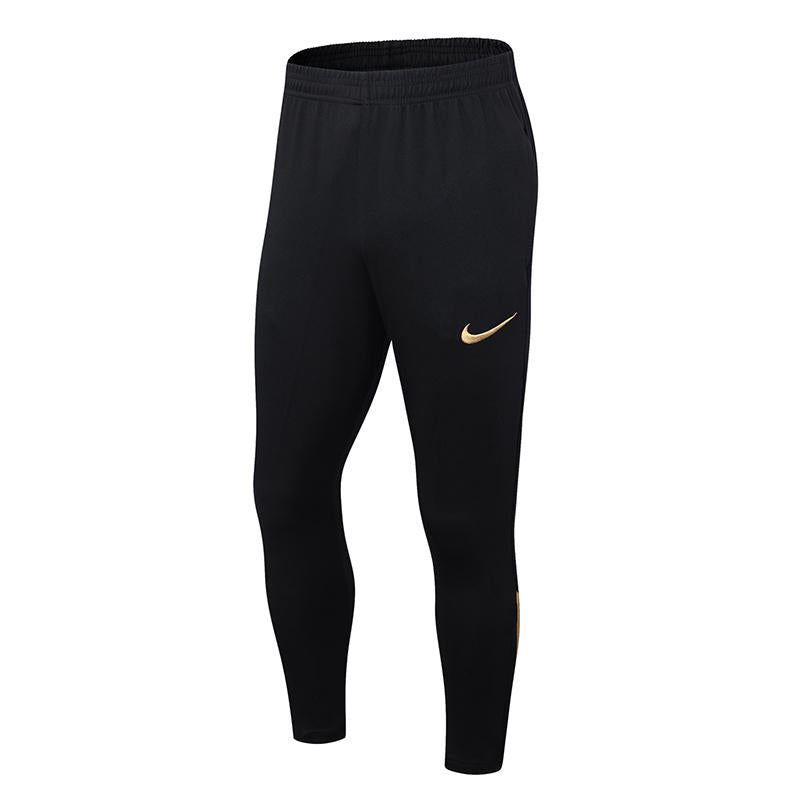 CONJUNTO NIKE NEGRO CON DORADO